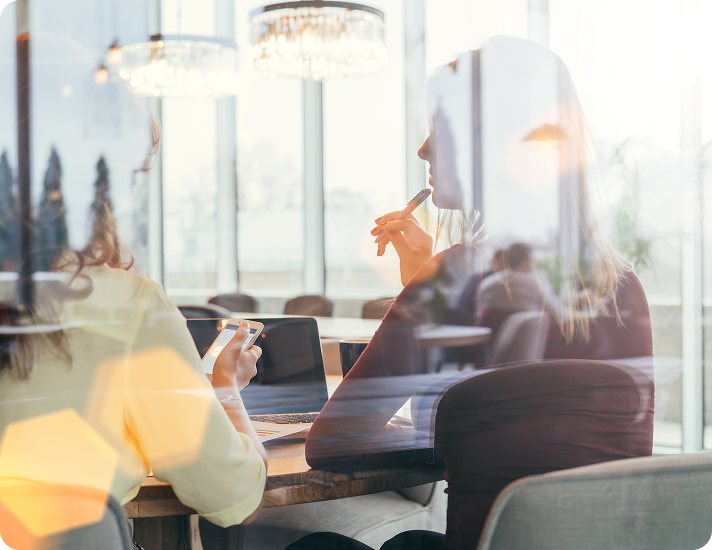 people-working-photographed-through-window